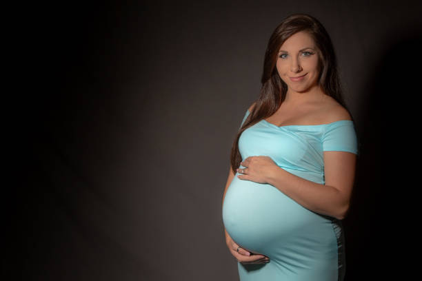 istock pregnant young women posing 1027379908