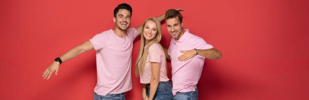 istock One blonde girl with two handsome men. 1027390752