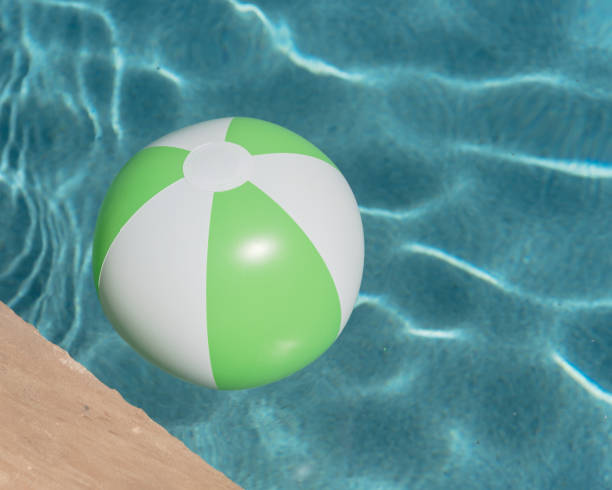 istock Top view close-up beach ball near swimming pool coping 1027393506