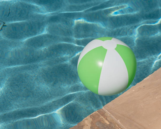 istock Top view close-up beach ball near swimming pool coping 1027393816