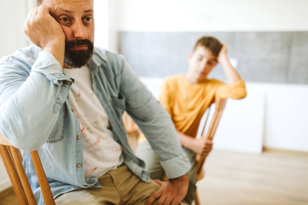 Father and son tired of renovating the apartment Father and son tired of renovating the apartment lazy construction laborer stock pictures, royalty-free photos & images
