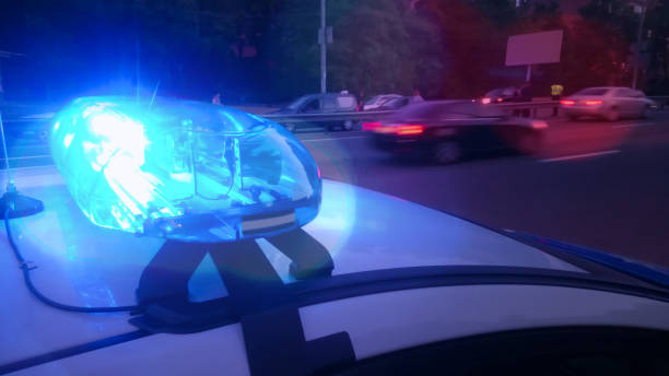 istock Closeup blinking strobe lights on police car, blue lightbar, emergency situation 1027397112