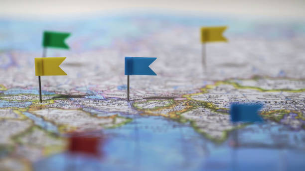 istock Locations marked with pins on world map, global communication network, closeup 1027397424