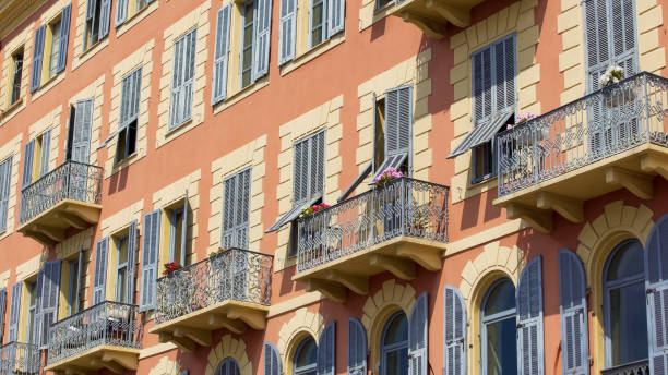 istock Residential complex windows and balconies shut on sunny day, urban architecture 1027397584