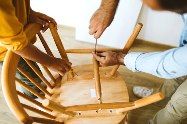 istock Father and son making chair 1027399836
