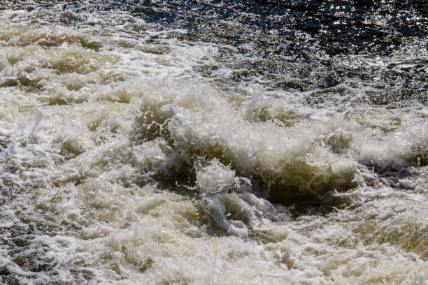 istock flow of water and spray from a stone 1027399860