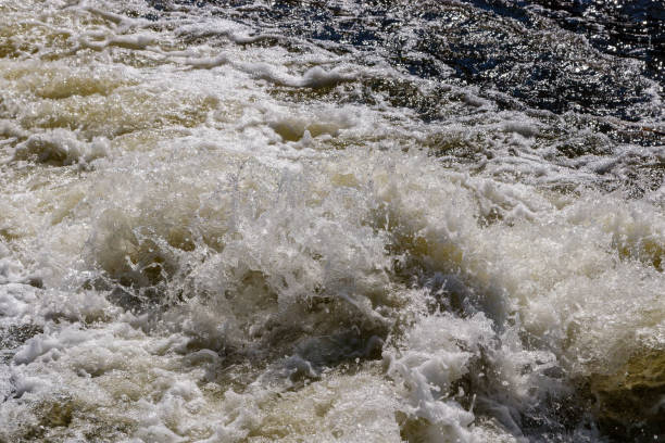 istock flow of water and spray from a stone 1027399936