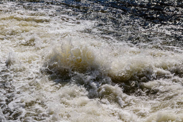 istock flow of water and spray from a stone 1027400158