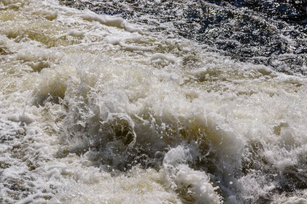 istock flow of water and spray from a stone 1027400420
