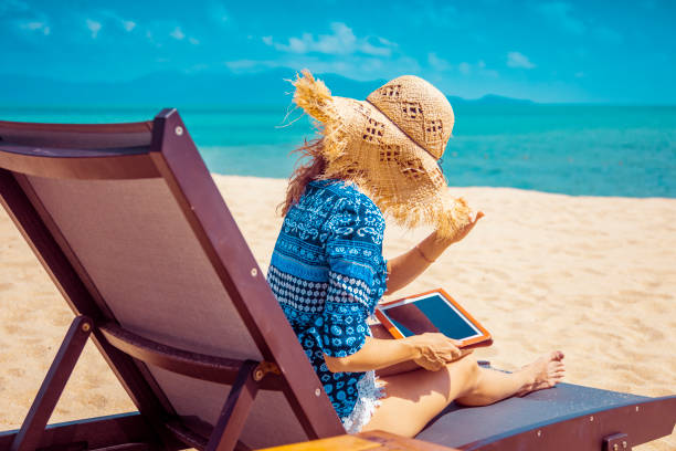 istock Woman in beach chair 1027407162