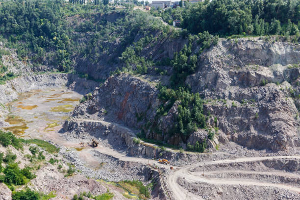 istock Extraction of mineral resources in the granite quarry 1027415526