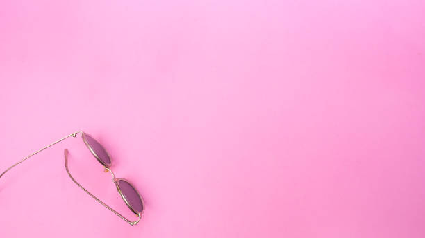istock glasses on pink background.Top view 1027418624