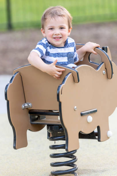 istock smiling toddler playing at the playground 1027418754