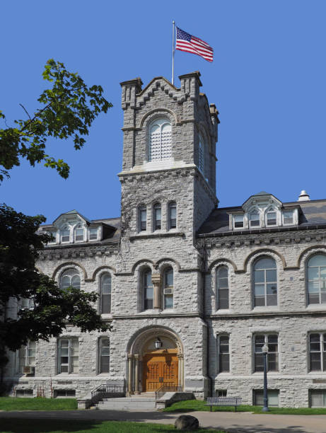 istock Old stone building with American flag on tower 1027418810