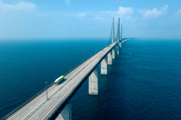 Semi-Truck Crossing Oresund Bridge Aerial View of a Semi-Truck Crossing Oresund Bridge oresund region photos stock pictures, royalty-free photos & images