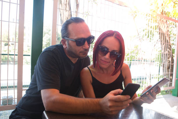 istock Happy couple looking at mobile phone. 1027421426
