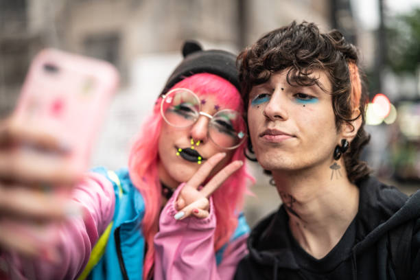 Alternative Lifestyle Young Couple Taking a Selfie Real People emo stock pictures, royalty-free photos & images