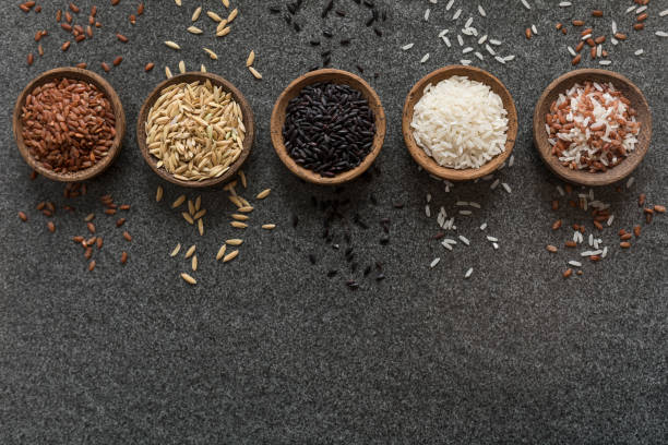 istock Variation of bowls of different rice background 1027427546