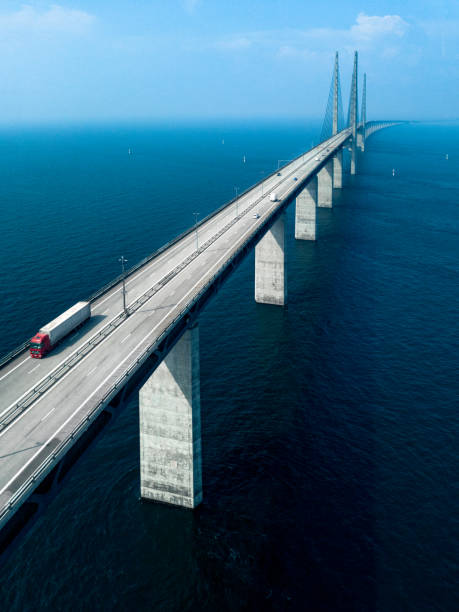 Semi-Truck Crossing Oresund Bridge Aerial View of a Semi-Truck Crossing Oresund Bridge oresund bridge stock pictures, royalty-free photos & images