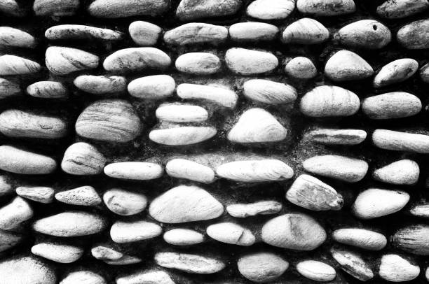 real stone wall surface with cement . Effect black and white filter