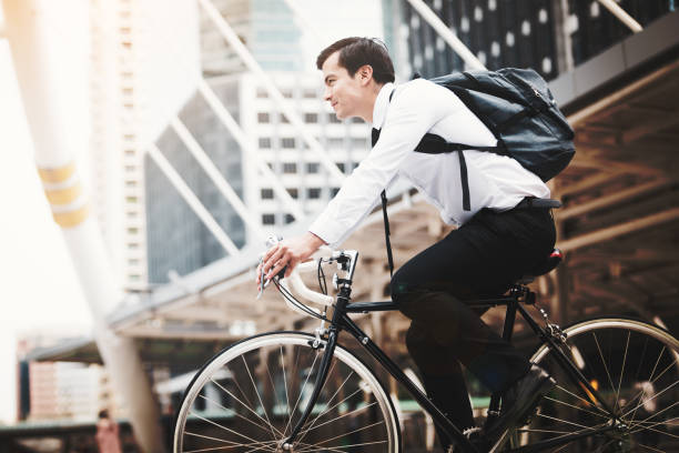 Business man worker riding bicycles in city stock photo