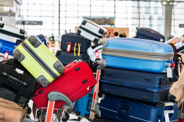 Large pile of luggage at the airport.