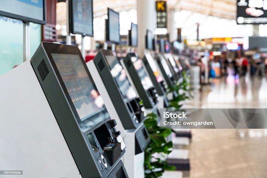 Self Check In Machine in Airport Flight online check-in counter. Individuality Stock Photo