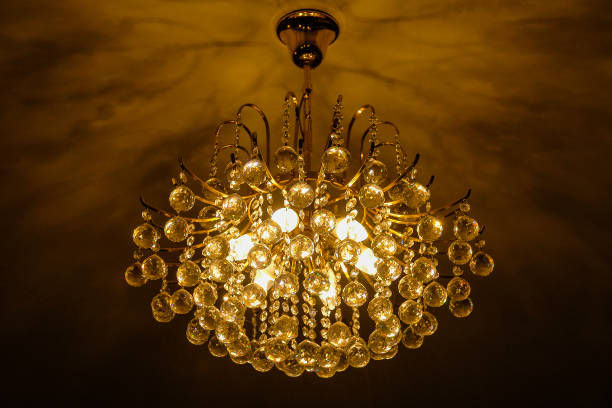 istock Warm white chandelier or lamp with ceiling in the hall 1027444150