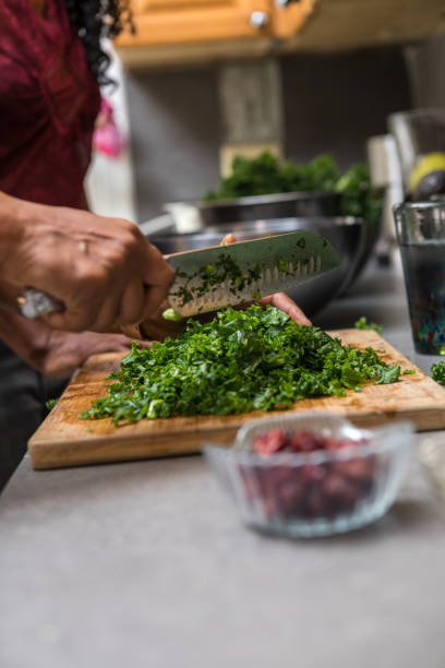 istock preparing and cutting kale to make a salad 1027455656