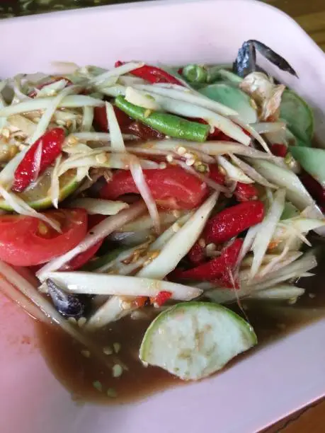 Papaya salad is famous food in Thailand and very delicious. Everybody like this.