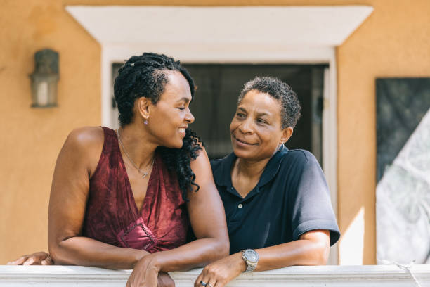 istock loving lesbian couple posing on the porch 1027461132