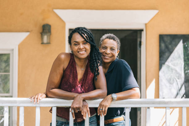 istock loving lesbian couple posing on the porch 1027461136