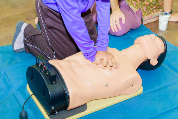 istock hand student Heart pump with medical dummy on CPR, in emergency refresher training to assist of physician 1027463834