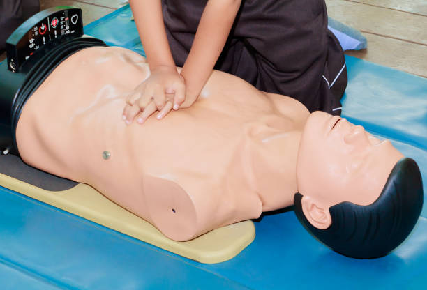 istock hand student Heart pump with medical dummy on CPR, in emergency refresher training to assist of physician 1027463840