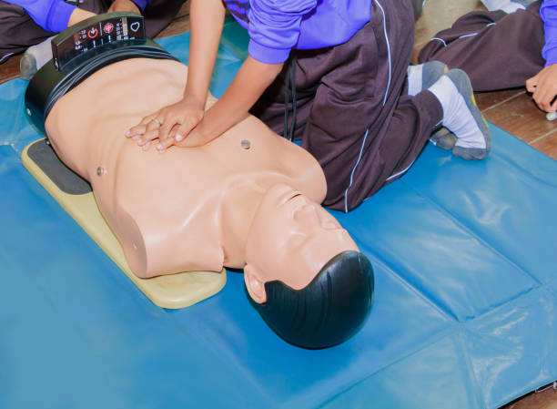 istock hand student Heart pump with medical dummy on CPR, in emergency refresher training to assist of physician 1027463842