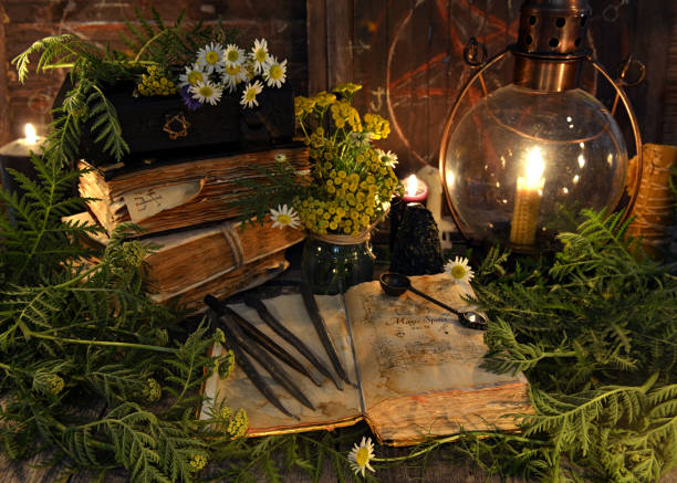 istock Still life with book with magic spellings, herbs, black candle and old lamp 1027467038