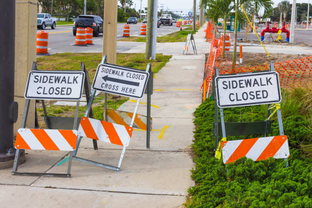istock Construction safety sign warns pedestrians the sidewalk is closed 1027480154