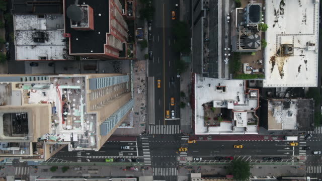 overhead aerial cars driving in Midtown Manhattan traffic New York City
