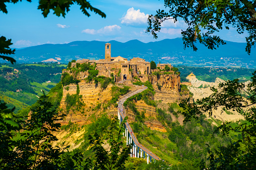 Civita di Bagnoregio, Lazio / Italy - 2018/05/26: Panoramic view of historic town of Civita di Bagnoregio with surrounding hills and valleys of Lazio region