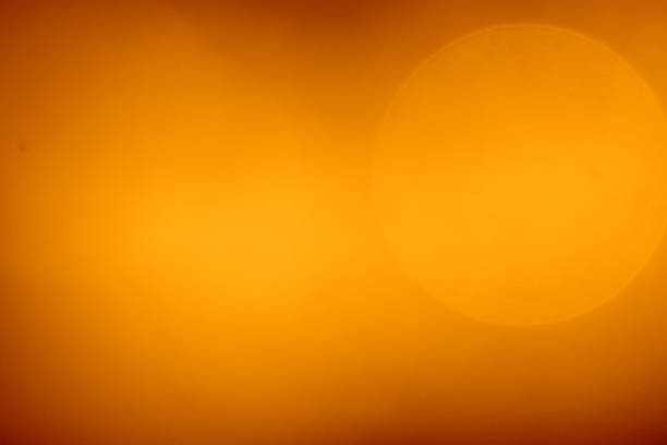 istock Abstract Backgrounds Large Dreamy Bokeh Light Coppery Orange Glow 1027486400