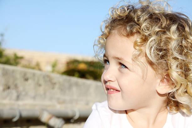 child looking upwards stock photo