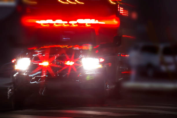 Emergency Responder An ambulance rushes to the scene of an accident. illuminated stock pictures, royalty-free photos & images