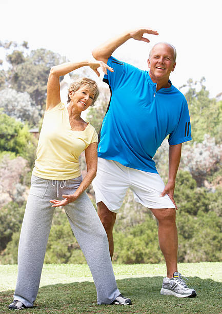 istock Senior Couple Exercising In Park 102749493