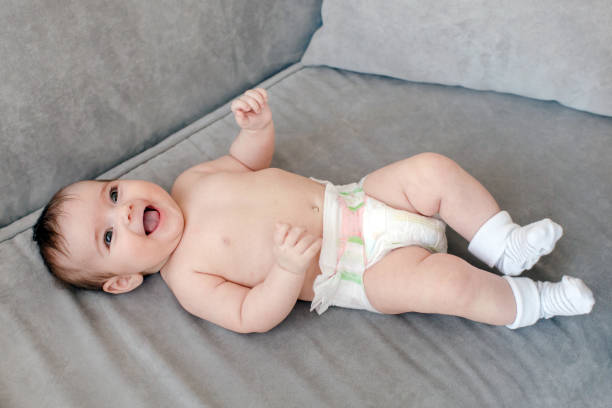 istock Cheerful adorable baby on sofa 1027496522