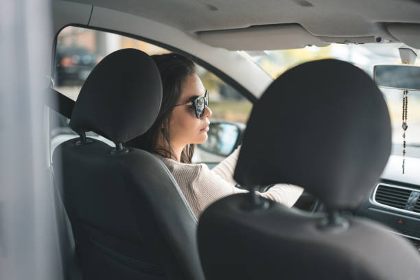 istock Attractive brunette drives a car 1027504440