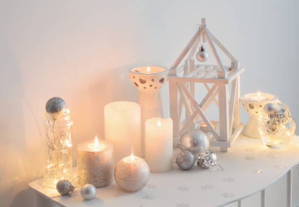 istock Christmas decoration with candles on background  white wall 1027507148