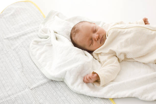 istock Sleeping newborn baby on blanket 1027513444