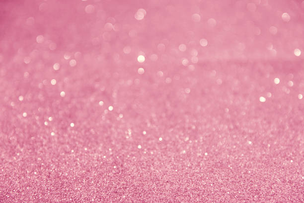 istock Glitter pink lights abstract background, silver and white, defocused 1027513676