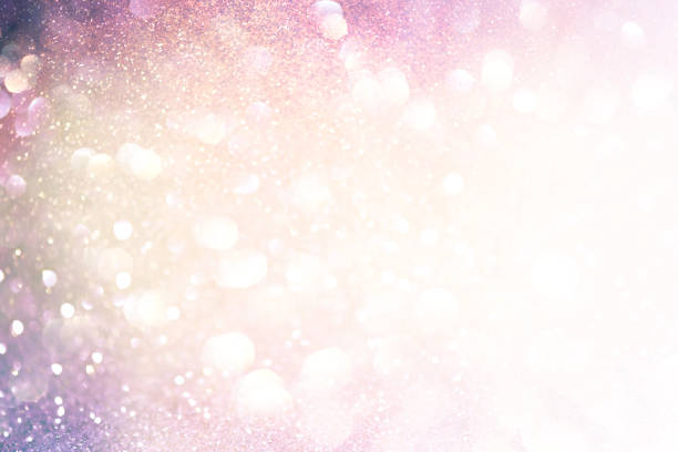 istock abstract sparkling lights, holiday festive background 1027516936