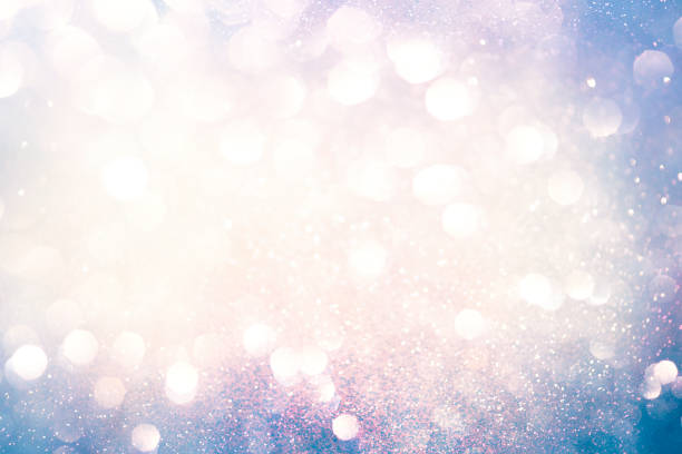 istock abstract sparkling lights, holiday festive background 1027517152